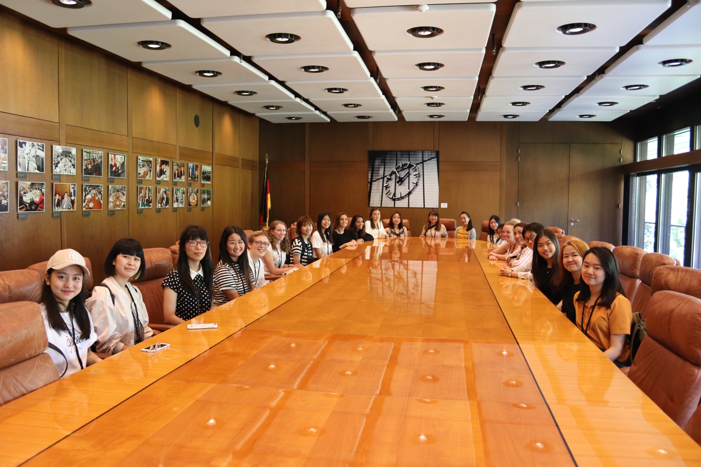 Group of students sitting at a big conference table