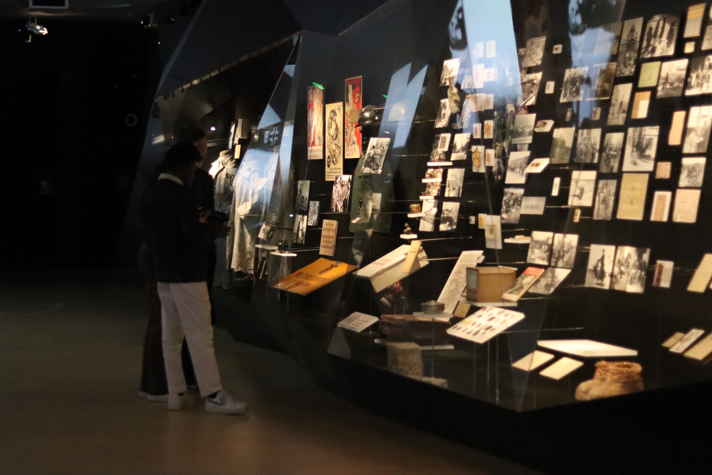 Part of the exhibition at a museum in Brussels. In the glass display are old pictures and posters.