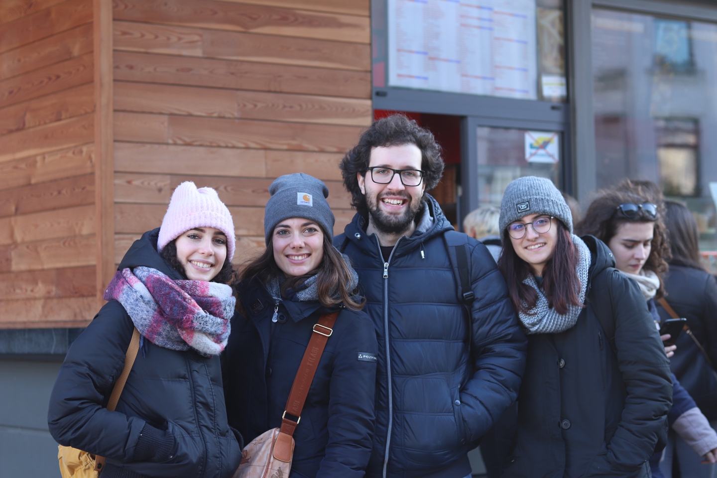 Four students smiling at the trip to brussels